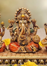 Brass Lakshmi Ganesha Saraswati idol set, close-up detail