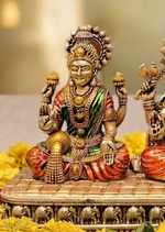 Brass Lakshmi Ganesha Saraswati idol set, angled view