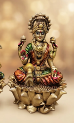 Brass Lakshmi Ganesh idol on lotus base, close-up detail